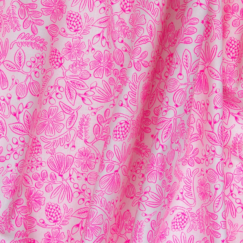 Impossibly bright pink leaves, flowers and buds on white cotton