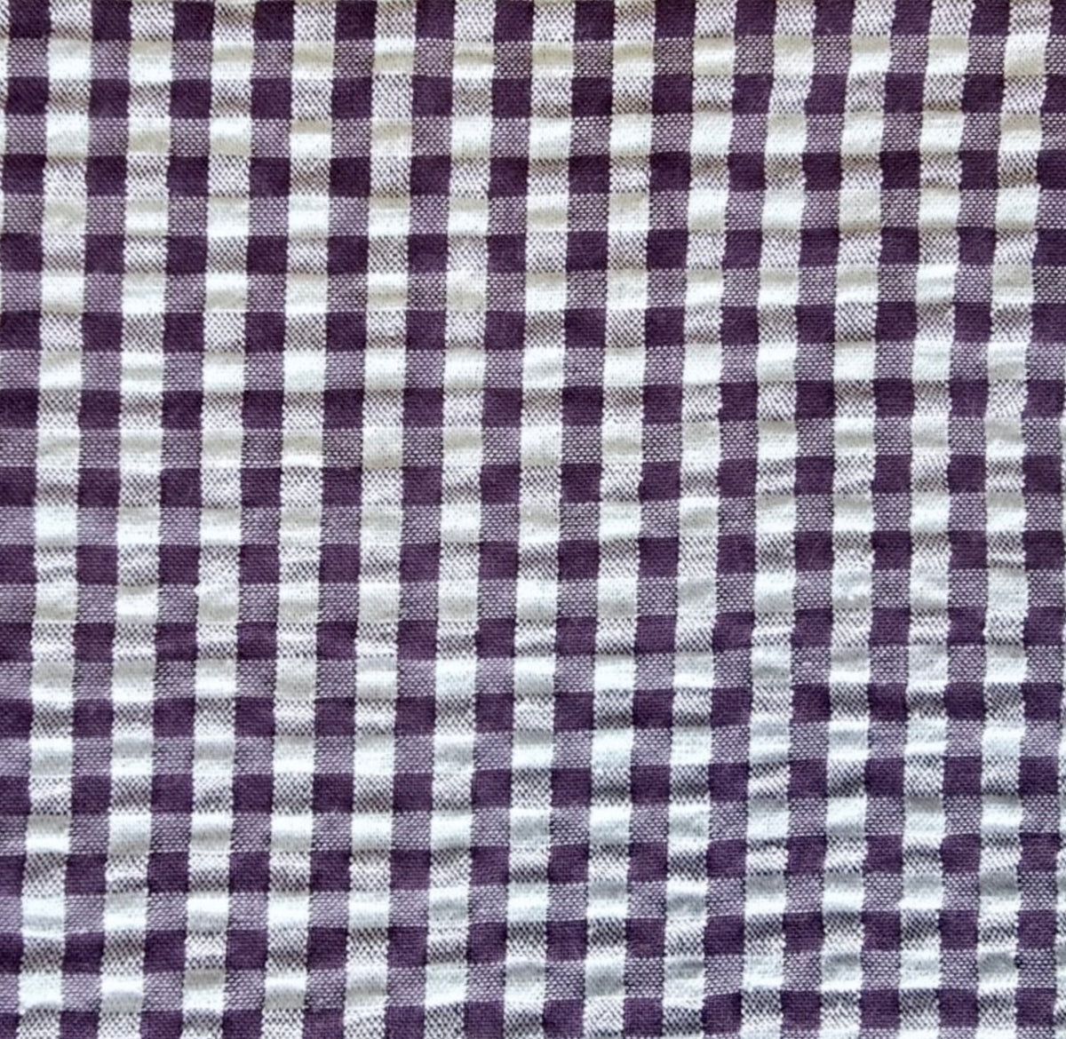 Plum and white gingham seersucker fabric 